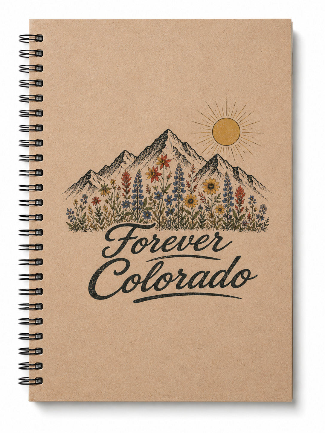 A spiral-bound notebook with a kraft paper cover featuring an illustration of mountains, wildflowers, a sun, and the words 'Forever Colorado' in black script.