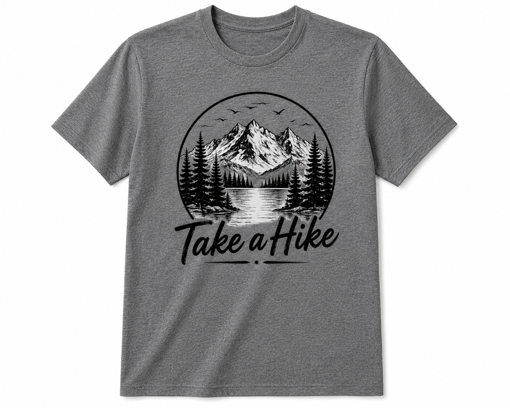 A heather gray short-sleeve crewneck t-shirt featuring a black circular graphic of a mountain landscape with pine trees and the text 'Take a Hike' printed below it.
