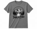 A heather gray short-sleeve crewneck t-shirt featuring a black circular graphic of a mountain landscape with pine trees and the text 'Take a Hike' printed below it.