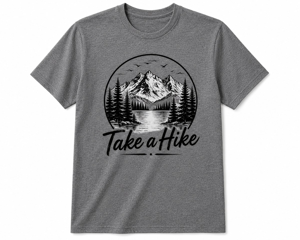 A heather gray short-sleeve crewneck t-shirt featuring a black circular graphic of a mountain landscape with pine trees and the text 'Take a Hike' printed below it.