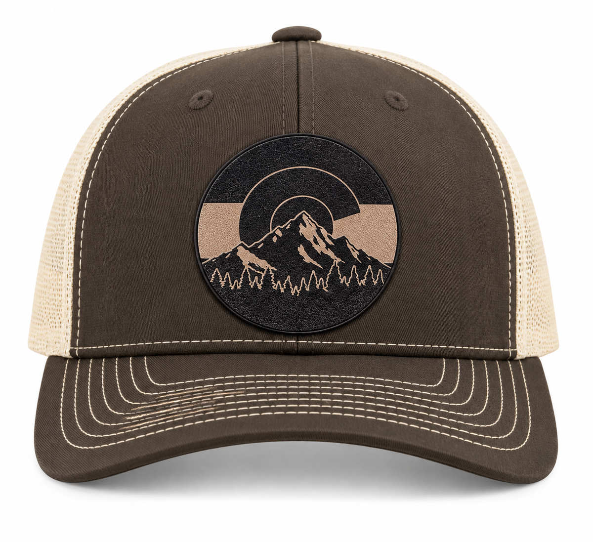 Front view of a two-tone Mountain Heritage trucker hat with a leather mountain patch