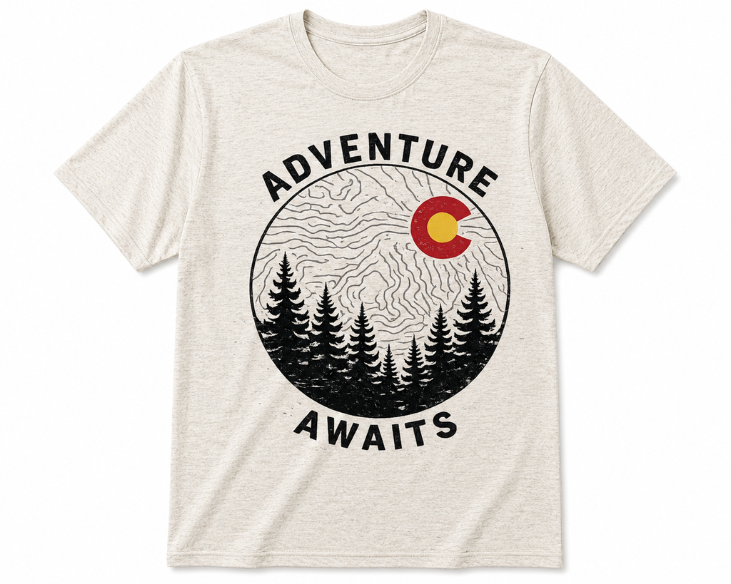 Adventure Awaits Colorado T-Shirt flat lay on white background