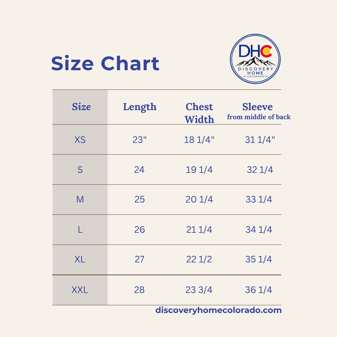 A size chart graphic for Discovery Home Colorador, showing measurements for sizes XS through XXL in a table with columns for Length, Chest Width, and Sleeve from middle of back, on a light beige background.
