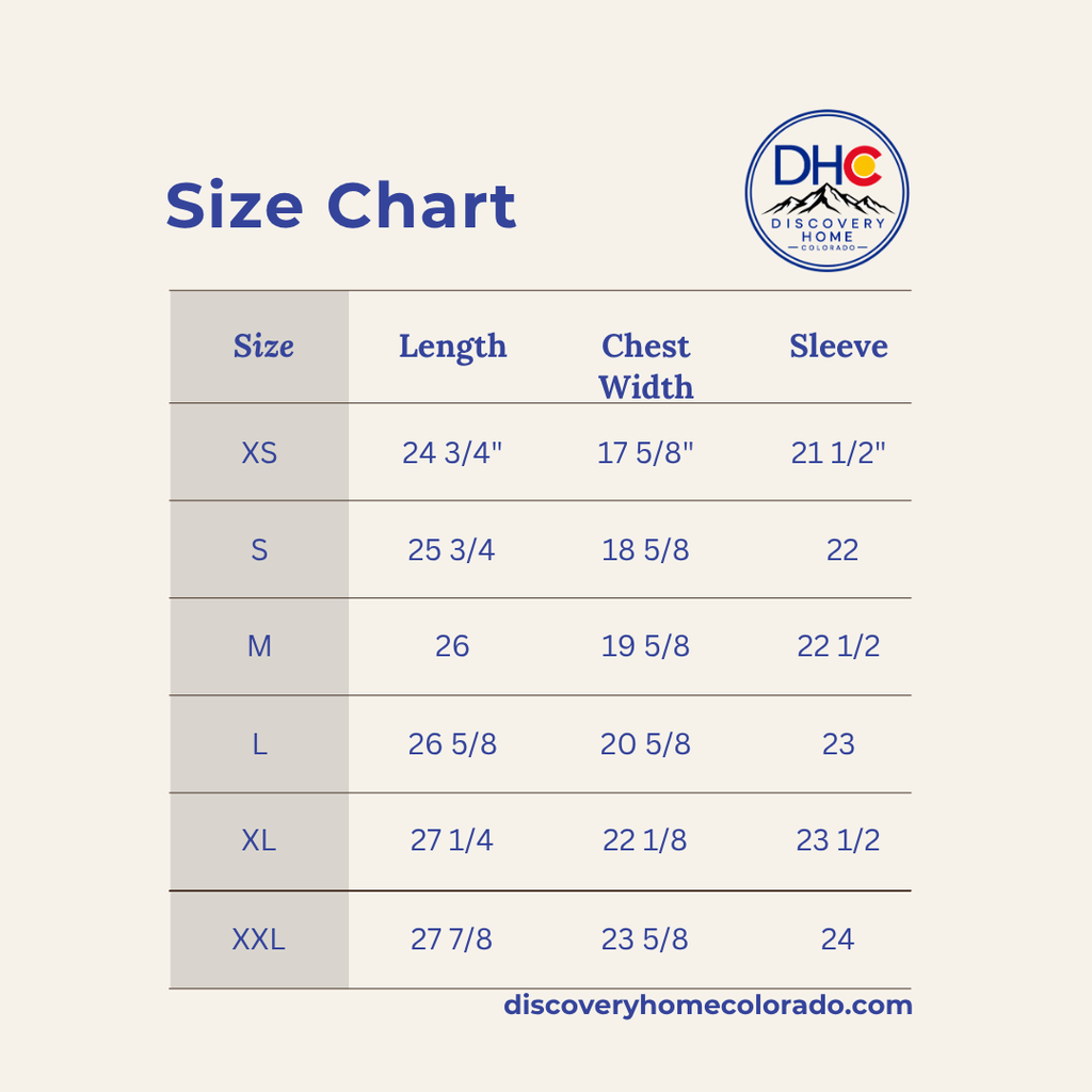 A size chart table for Discovery Home Colorado, showing measurements for sizes XS through XXL in length, chest width, and sleeve. The chart is displayed on a light beige background with blue text and a Discovery Home logo in the top right.