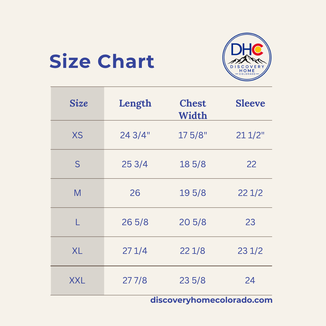 A size chart table for Discovery Home Colorado, showing measurements for sizes XS through XXL in length, chest width, and sleeve. The chart is displayed on a light beige background with blue text and a Discovery Home logo in the top right.